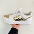 GUESS DORADO METALICO